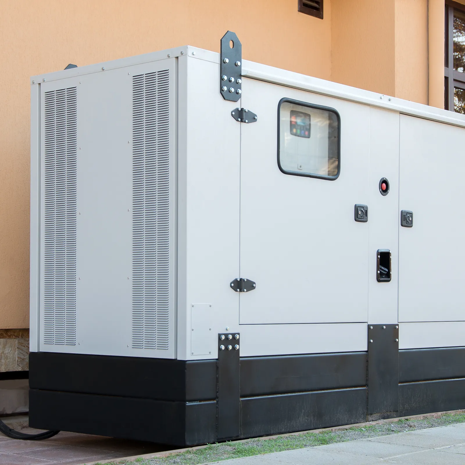 Enclosed standby generator installed beside a commercial building (representative image)
